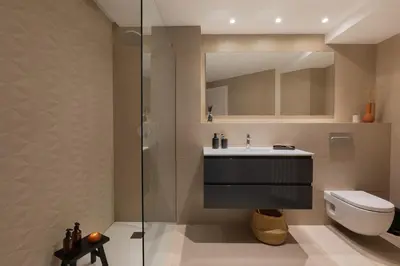 a bedroom with a bed with two pillows and two lamps at Talat - 3 bedrooms in Eixample Esquerra in Barcelona