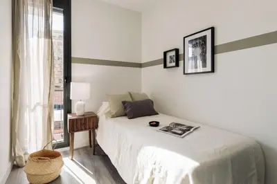 a patio with a table and chairs on a roof at Montsia - 3 bedrooms and a terrace in Les Corts in Barcelona