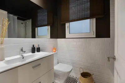 a bedroom with a bed and a table with a lamp at Amourah - 2 bedrooms in Eixample Esquerra in Barcelona