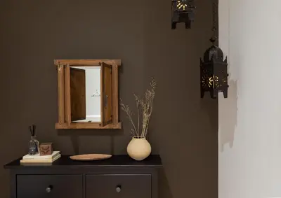 a mirror and a vase on a dresser in a room at Amourah - 2 bedrooms in Eixample Esquerra in Barcelona
