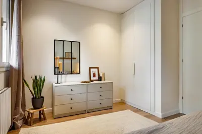 a dining room with a table and a mirror at Isilf - 2 bedrooms and balcony in Sant Gervasi in Barcelona