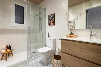 a bedroom with a bed and a dresser and a window at Isilf - 2 bedrooms and balcony in Sant Gervasi in Barcelona