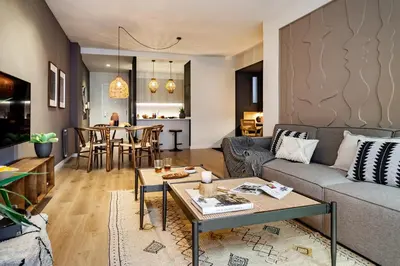 a living room with a couch and a table at Isilf - 2 bedrooms and balcony in Sant Gervasi in Barcelona