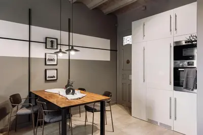 a living room with a couch and a table at Pirineu - 2 bedrooms in Sant Gervasi in Barcelona