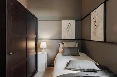 a living room with a table and a couch at Pirineu - 2 bedrooms in Sant Gervasi in Barcelona