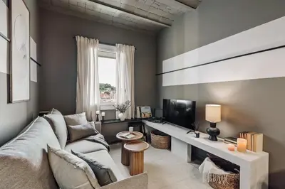 a bedroom with a bed with four mirrors on the wall at Pirineu - 2 bedrooms in Sant Gervasi in Barcelona