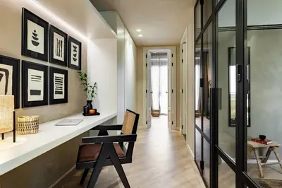 a living room with a wooden table with a vase on it at Nubian - 2 bedrooms in Eixample Dreta in Barcelona