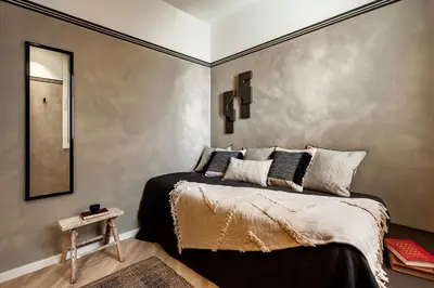 a room with a mirror and a vase on a table at Nubian - 2 bedrooms in Eixample Dreta in Barcelona