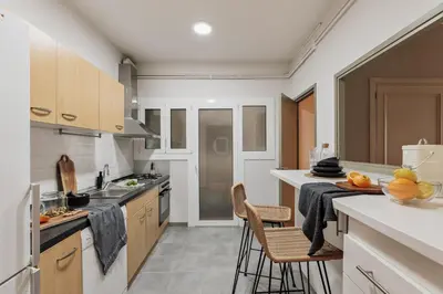 a living room with a couch and a table at Basil - 3 bedrooms and terrace in Sant Gervasi in Barcelona