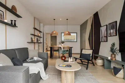 a kitchen with a counter and two stools at Basil - 3 bedrooms and terrace in Sant Gervasi in Barcelona