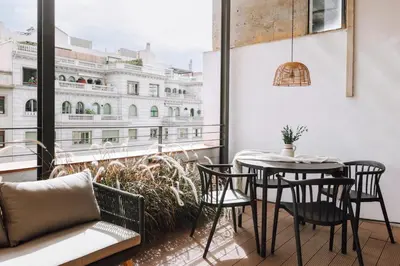 a mirror on a wall in a living room at Sultan - 2 bedrooms and terrace in Eixample Dreta in Barcelona