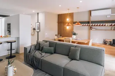 a bathroom with a sink and a toilet and a hallway at Sultan - 2 bedrooms and terrace in Eixample Dreta in Barcelona