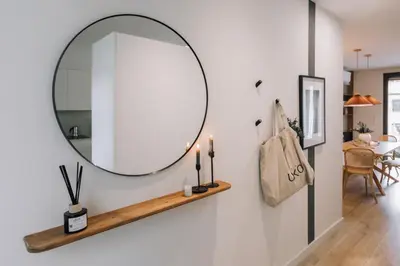 a bedroom with a bed and a table and a desk at Sultan - 2 bedrooms and terrace in Eixample Dreta in Barcelona