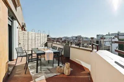 a bedroom with a bed and a chair and a window at Fluvia - 2 bedrooms and terrace in Sant Gervasi in Barcelona