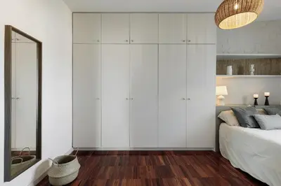 a bedroom with a large bed and two lamps at Fluvia - 2 bedrooms and terrace in Sant Gervasi in Barcelona