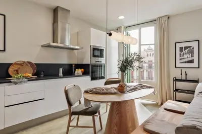 a living room with a couch and a table at Mescit - 2 bedrooms and balcony in Eixample Dreta in Barcelona