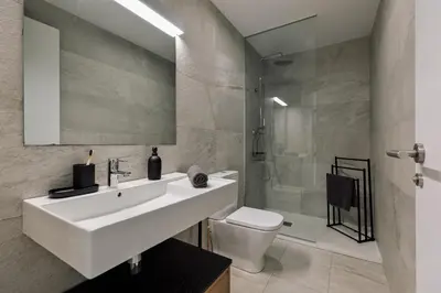 a bedroom with a mirror and a bed at Mescit - 2 bedrooms and balcony in Eixample Dreta in Barcelona