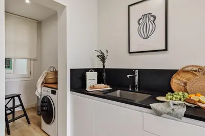 a living room with a couch and a table at Mescit - 2 bedrooms and balcony in Eixample Dreta in Barcelona