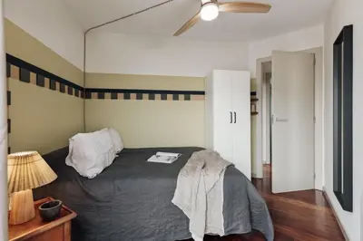 a living room with a couch and a tv at Misir - 2 bedrooms and terrace in Eixample Dreta in Barcelona