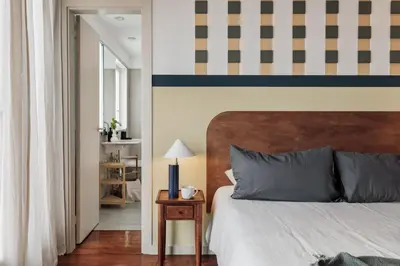 a bedroom with a bed with a book on it at Misir - 2 bedrooms and terrace in Eixample Dreta in Barcelona