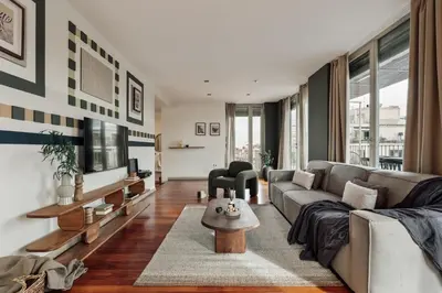 a bedroom with a bed and a desk at Misir - 2 bedrooms and terrace in Eixample Dreta in Barcelona
