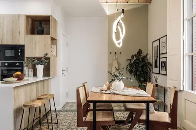 a bedroom with a bed and two mirrors on the wall at Salar - 2 bedrooms in Gràcia in Barcelona