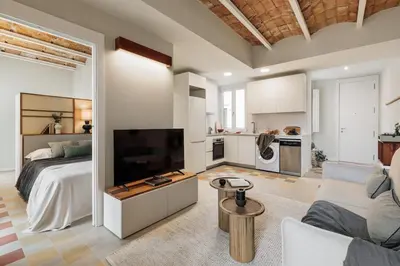 a bedroom with a bed with a tray on it at Pacaya - 2 bedrooms, office and balcony in Eixample Dreta in Barcelona