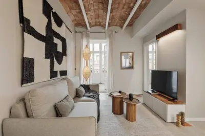 a small dining room with a table and chairs at Pacaya - 2 bedrooms, office and balcony in Eixample Dreta in Barcelona