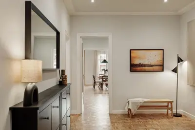 a living room with a couch and a table at Adile - 4 bedrooms and balcony in El Putxet in Barcelona