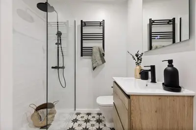 a bedroom with a bed and a desk at Adile - 4 bedrooms and balcony in El Putxet in Barcelona