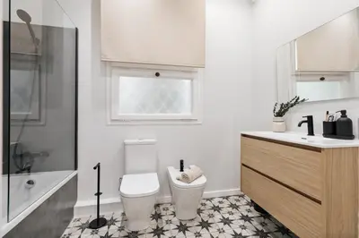a bedroom with a large bed and a mirror at Adile - 4 bedrooms and balcony in El Putxet in Barcelona
