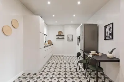 a dining room with a table and a mirror at Adile - 4 bedrooms and balcony in El Putxet in Barcelona