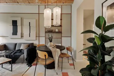 a living room with a couch and a tv at Indiana - 2 bedrooms, office and balcony in Eixample Dreta in Barcelona