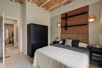 a living room with a couch and a table at Indiana - 2 bedrooms, office and balcony in Eixample Dreta in Barcelona