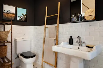 a bathroom with a white sink and a toilet at Batam - 1 bedroom and terrace in Gràcia in Barcelona
