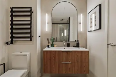 a bedroom with a bed and a mirror at Minchin - 1 bedroom, balcony and pool in Poblenou in Barcelona