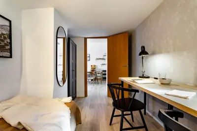 a living room with a flat screen tv on a entertainment center at Hassi - 2 bedrooms and terrace in Gràcia in Barcelona