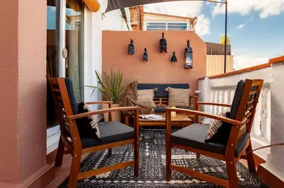 a bathroom with a toilet and a sink and a tub at Hassi - 2 bedrooms and terrace in Gràcia in Barcelona