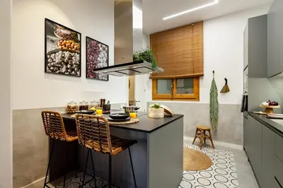 a bedroom with a large bed and a large window at Sumbawa - 2 bedrooms in Eixample Dreta in Barcelona