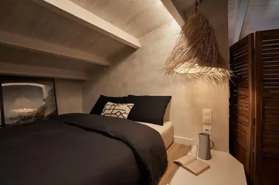 a kitchen and living room with a couch and a table at Kalahari - 2 bedrooms and terrace in Gràcia in Barcelona