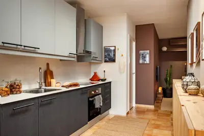 a living room with a couch and a table at Finnt - 1 bedroom and terrace in Eixample Dreta in Barcelona
