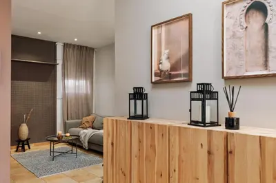 a bed with a tray with a tea set on it at Finnt - 1 bedroom and terrace in Eixample Dreta in Barcelona