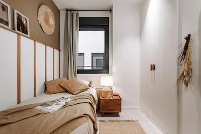 a living room with a couch and a table at Pinar - 2 bedrooms and office in Eixample Esquerra in Barcelona