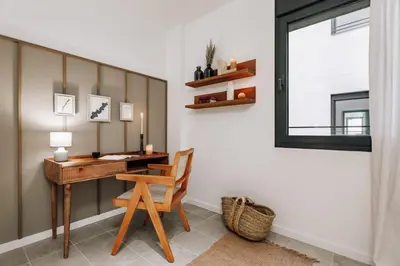 a living room with a flat screen tv on a wall at Pinar - 2 bedrooms and office in Eixample Esquerra in Barcelona