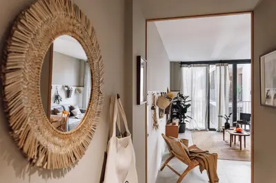 a living room with a couch and a table at Pinar - 2 bedrooms and office in Eixample Esquerra in Barcelona