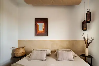 a dining room with a table and chairs and a tv at Idir - 2 bedrooms, a pool and terrace in Poblenou in Barcelona