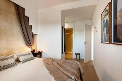 a bedroom with a bed and a mirror at Idir - 2 bedrooms, a pool and terrace in Poblenou in Barcelona