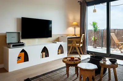 a balcony of a building with a view of a city at Idir - 2 bedrooms, a pool and terrace in Poblenou in Barcelona