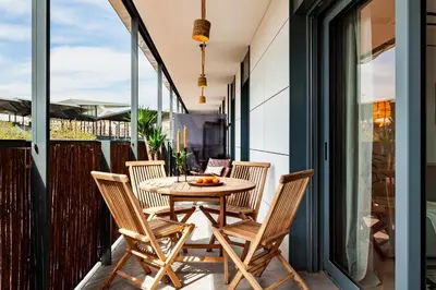 a living room with a couch and a table at Idir - 2 bedrooms, a pool and terrace in Poblenou in Barcelona