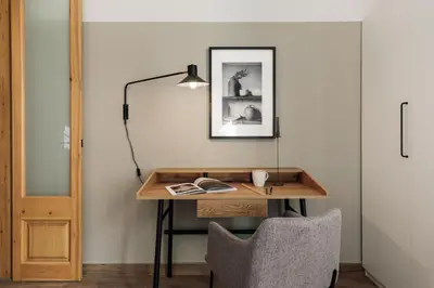 a hallway with a mirror and a vase on a shelf at Chixoy - 3 bedrooms and balcony in Eixample Dreta in Barcelona